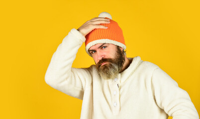 Ready for holiday. Handsome male model wearing warm hat. casual man in winter hat and warm clothes. happy hipster wear warm hat. cold and flu. Portrait of brutal man in fleece sweatshirt