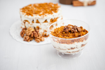 portioned homemade cake dessert with honey and walnuts on a light background