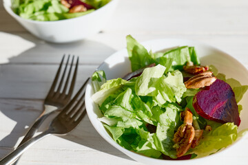 Vegan salad with lettuce, red beet and pecan nuts. Healthy Food. Diet. Healthy lifestyle concept. Cooking At Home