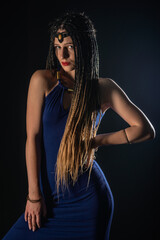 Fototapeta premium Portrait of a natural native, mystery girl wearing braids that looks like an ancient goddess.
