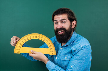 studying the measurement. formal education. male student at mathematics school lesson. pass the...