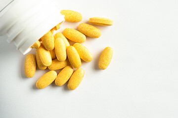 Vitamin B Complex Supplements Spilled from a Bottle