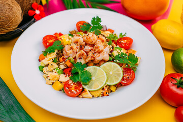 healthy food, salad with shrimps and vegetables with rice on a decorated table