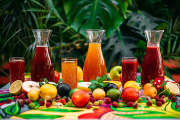 refreshing lemonade with fruits and berries on a decorated table