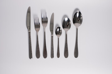 set of knives, spoons and forks isolated on a white background