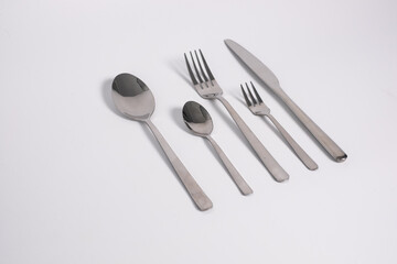 set of knives, spoons and forks isolated on a white background