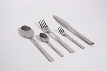 set of knives, spoons and forks isolated on a white background