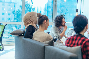 Business meeting between multi ethnic colleagues in a modern startup company.