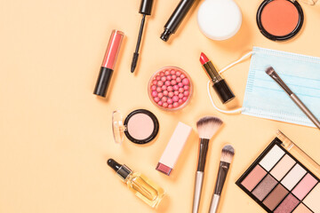 Make up products and face mask New normal concept. Flat lay image with copy space.