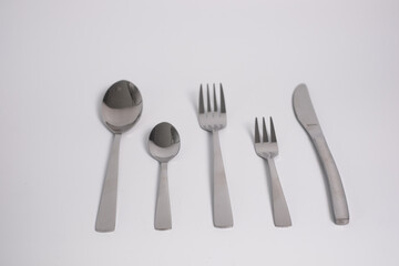 set of knives, spoons and forks isolated on a white background