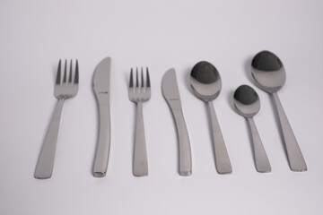 set of knives, spoons and forks isolated on a white background