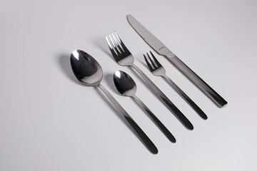 set of knives, spoons and forks isolated on a white background