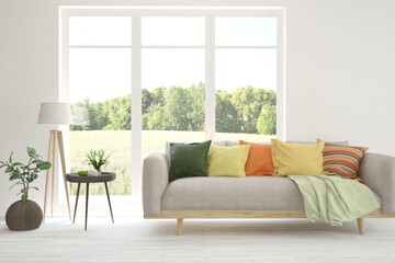 White living room with sofa and summer landscape in window. Scandinavian interior design. 3D illustration