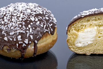 round donut with chocolate and sugar. Fat Thursday