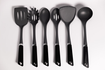 Stand with set of kitchen utensils. Isolated on a white background