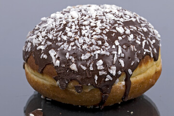 round donut with chocolate and sugar. Fat Thursday