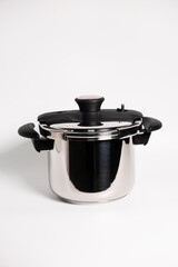 Stainless steel stewpot on white background