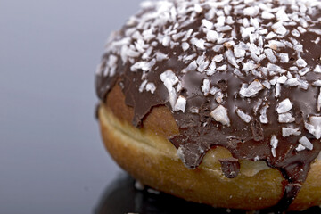 round donut with chocolate and sugar. Fat Thursday