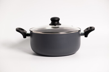Stainless steel stewpot on white background