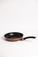 brown frying pan isolated on a white background
