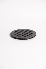 round black hot coasters, put hot utensils, on a white background, lie in a stack, isolate