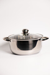 Stainless steel stewpot on white background
