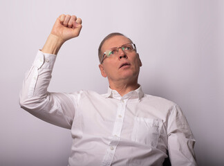 Adult man with fist up as gesture of support and solidarity
