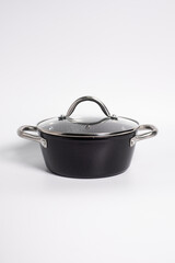 Stainless steel stewpot on white background