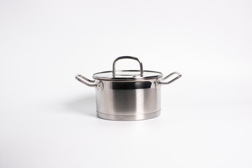 Stainless steel stewpot on white background