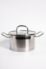 Stainless steel stewpot on white background