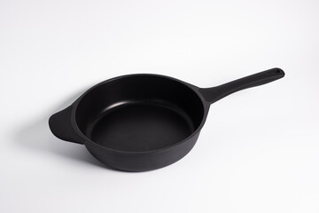 black frying pan isolated on a white background