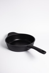 black frying pan isolated on a white background
