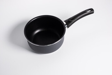 black stewpot on white background