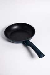 black frying pan isolated on a white background