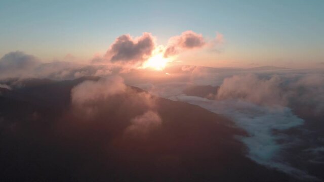 Epic flight through the pink sunset clouds