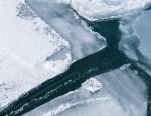 Beautiful abstract ice patterns in frozen stream