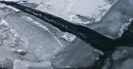 Beautiful abstract ice patterns in frozen stream