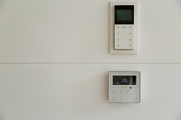 white Wall display shows air temperature inside the room. temperature and heating.