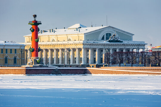 Roman-style columns - Rostralnaya Kolonna on Vasilyevsky island. Sights of St. Petersburg. Winter in the city on the Neva in Russia