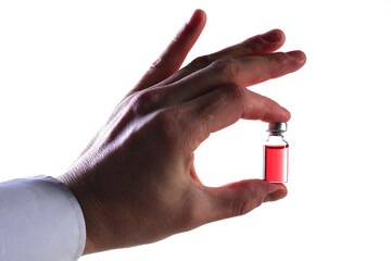 Doctor's hand holding a vial of vaccine on a white background