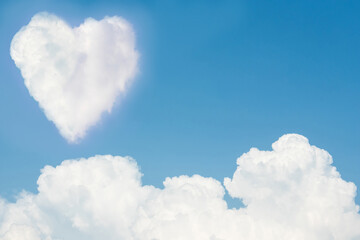 Naklejka na ściany i meble Heart on the sky with cloudy. Blue sky with hearts shape clouds natural background. love concept.