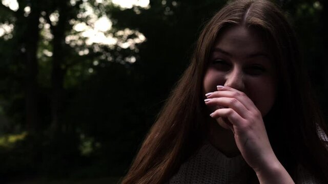 [4k] close up portrait of cute brunette woman who can't stop laughing