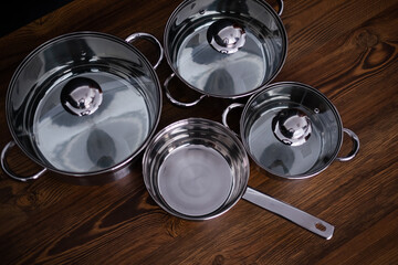 set of pots on wooden background