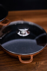 Set of grill pans on wooden table background