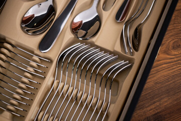Set of cutlery in a wooden case. Close up