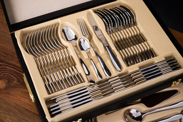 Set of cutlery in a wooden case. Close up