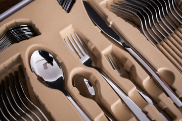 Set of cutlery in a wooden case. Close up