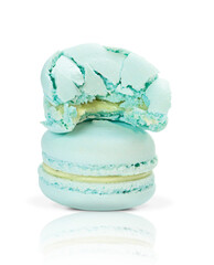 Two blue french macaroons
isolated on white background.