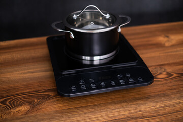 Close up view of an electrical kitchen induction ceramic hob.