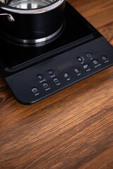 Fototapeta premium Close up view of an electrical kitchen induction ceramic hob.
